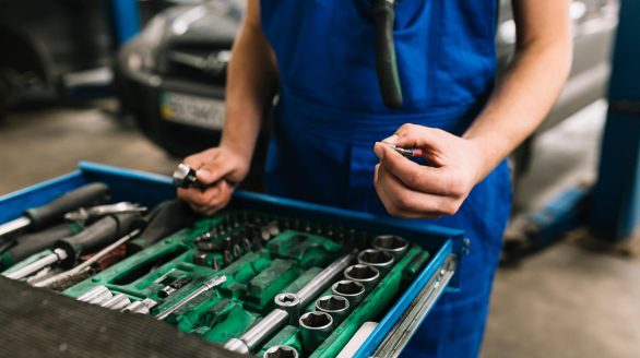 auto mechanic s hand holding spanners (1)