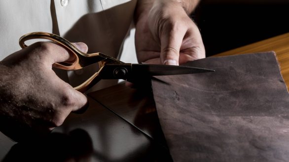 tailor cutting leather with scissors (1)